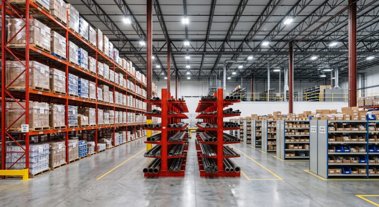 Industrial warehouse with pallet racking, cantilever racking and light shelving side by side